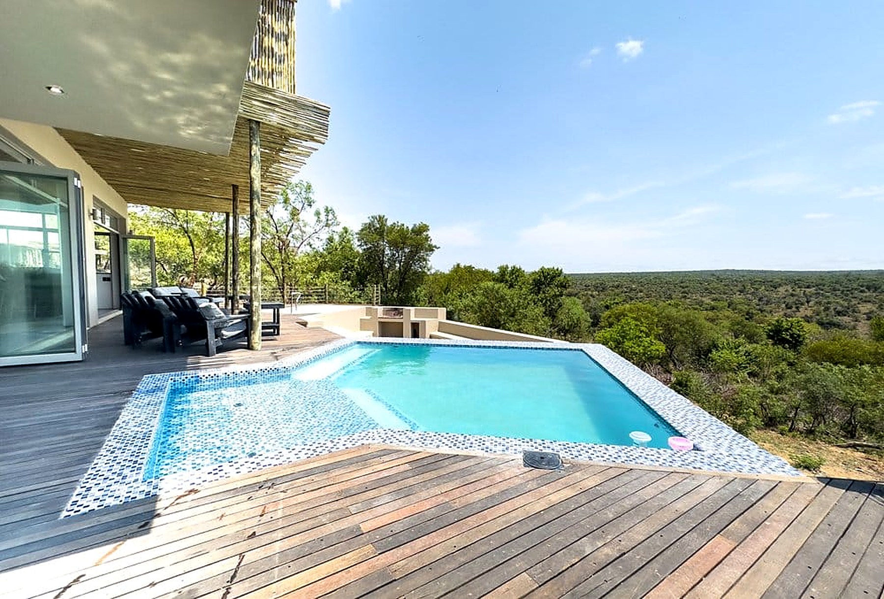 Infinity pool and timber deck at Sithrah Private Lodge